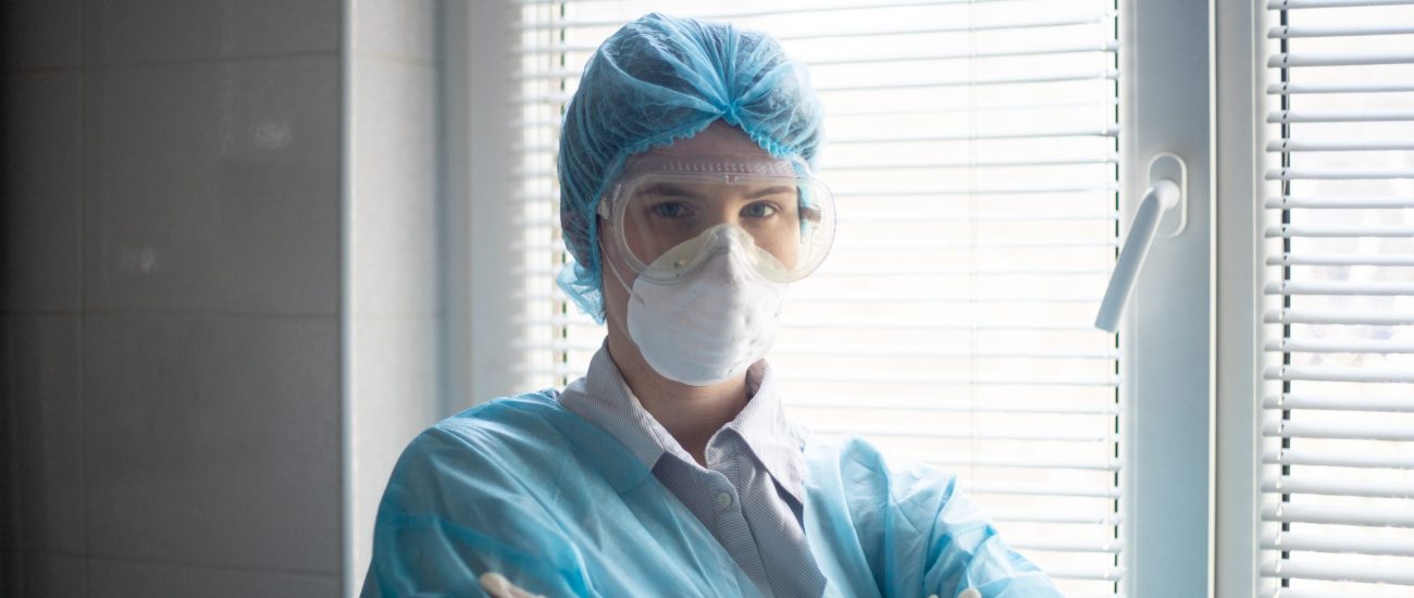 A shot of a female wearing a medical personnel protection equipment, to raise awareness of the ongoing pandemic situation